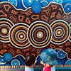 children interacting with Indigenous artwork