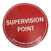 A round red sticker with white text reading 'SUPERVISION POINT' 