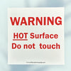 prevent burns by warning of potential hot surfaces