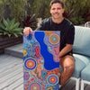 Indigenous-Artist-with-his-work
